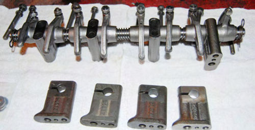 The pedestals supporting the valve train were found to have different heights, so new ones were purchased and these had to go to the machine shop to enlarge the opening so that the shaft would fit through them.