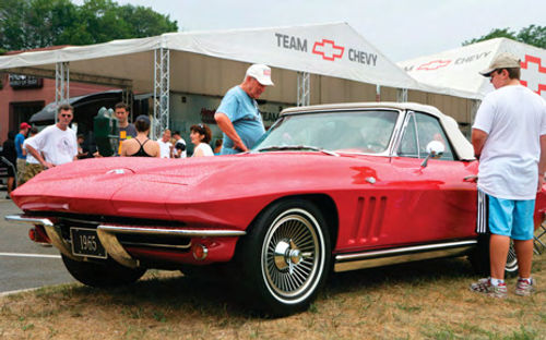 A 1965 Corvette on display during a rainy Woodward Dream Cruise in suburban Detroit.