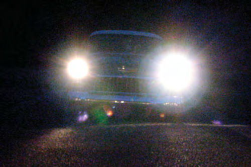 Photo 9. The photograph on the right shows the dramatic difference between an upgraded halogen headlight (driver’s side) and a sealed beam halogen (passenger’s side).