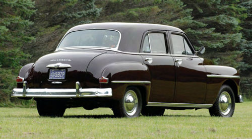 The feature car has Plymouth’s first all-new postwar body. But while it’s a huge step from its immediate predecessor, a rear view shows the boxiness that makes Plymouths of that era so practical.