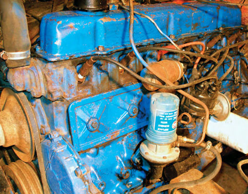 Photos 4 and 5. A coin-op car wash transformed the lump of grease under Ruby’s hood (top) into a nicely painted engine.