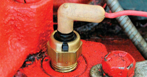 A common coolant temperature gauge sensor. Modern cars have a second sensor that supplies information to the engine control computer.