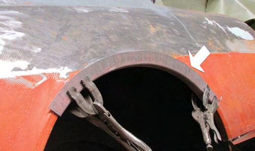 Photo 2. Taking care of this rust starts by forming a replacement wheel opening arch.