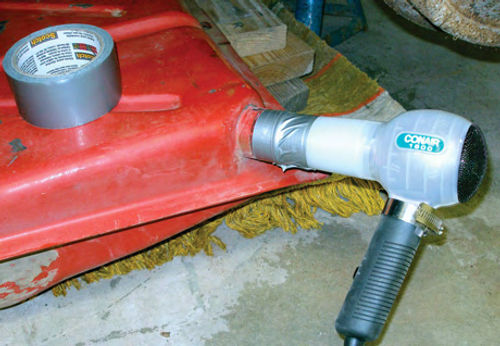 Photo 9. Before I reinstalled the sending unit, I used a hair dryer to remove all traces of water from Ruby’s gas tank.