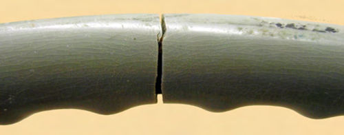 Deep cracks can be repaired using hand tools, epoxy putty and paint.