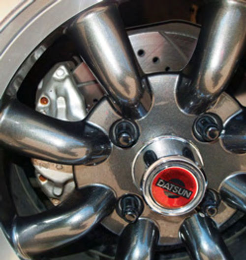 The car’s brakes have been upgraded with performance pads and drilled and slotted rotors.