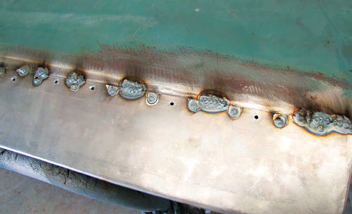 Photo 8. The seam line is treated the same way as the spot weld holes. Each weld is spaced a few inches apart to reduce heat warping.