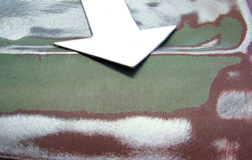 Photo 3. When an old paint edge tends to flake off instead of feather sand smooth, that coat of paint must be removed.