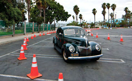 A 1939 Ford takes its turn on the course