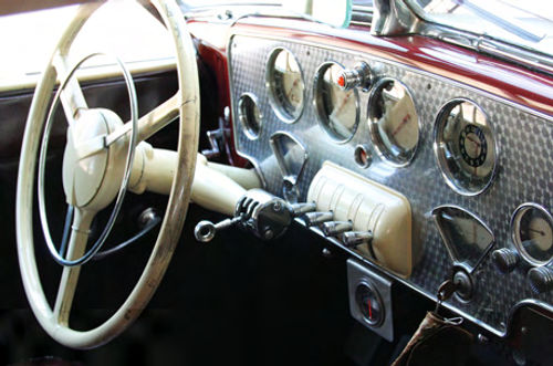 The dazzling dash looks like that of a vintage airplane. A full, easy-to-read array of instruments and no-nonsense toggle switches make driving easy. The Electric Hand shifter is on the stalk sticking out of the steering column.