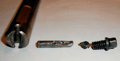 Photo 8. To the left is the sacrificed pinion shaft, and to the right the bolt that caused the problems.