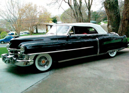 The pellets you see around it are the result of a brief hail storm. On the right is a friend’s 1950 Cadillac convertible that Eric painted and buffed out.