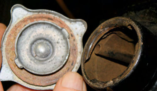 Photo 4. Open Radiator Cap: Old (around pre-’35) radiator systems had sealed caps and an overflow tube open to the atmosphere.