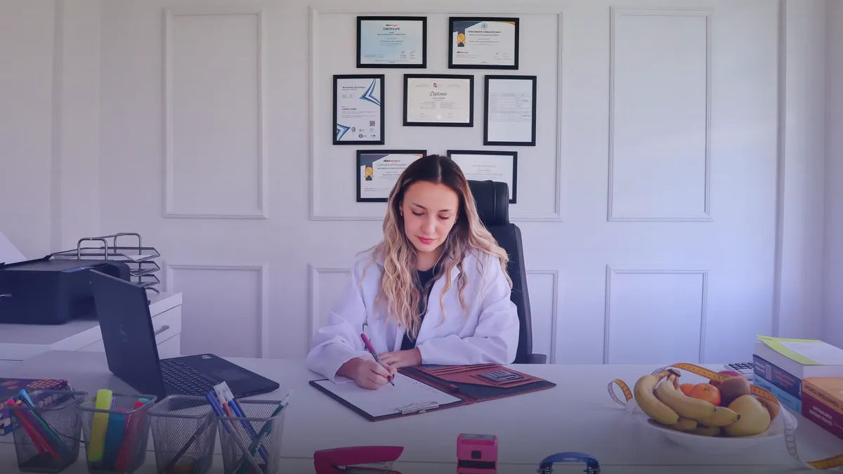 Professional consultant desk setup with laptop and notebook