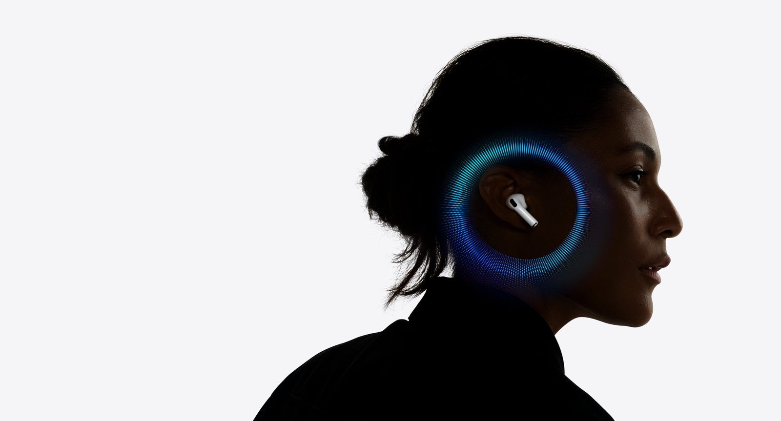 Profile silhouette of a person wearing an AirPod with blue sound waves radiating around the ear