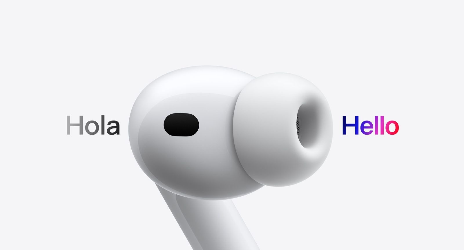 Close-up of an AirPods Pro earbud with the word Hola on one side and Hello on the other