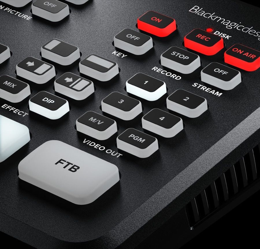 Close-up of the ATEM Mini Pro control surface showing illuminated red REC and ON AIR buttons beside the KEY, RECORD, STREAM and VIDEO OUT button groups
