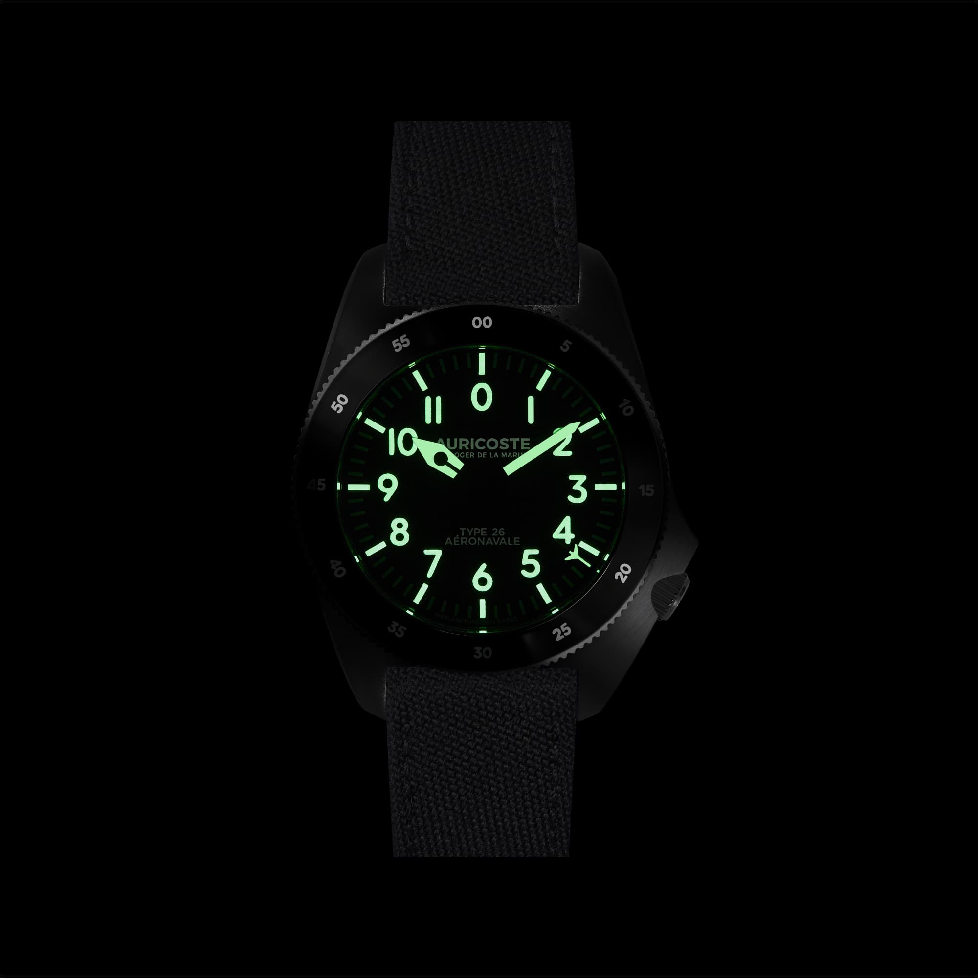 The same Type 26 photographed in the dark, numerals and hands glowing green