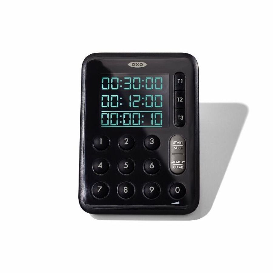OXO Good Grips Triple Timer, a black wedge with three stacked green LCD rows, T1 T2 T3 buttons and a full numeric keypad