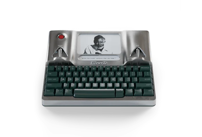 Hemingwrite Signature Edition in polished bare aluminium with dark green keycaps and a portrait of Ernest Hemingway on the e-ink screen