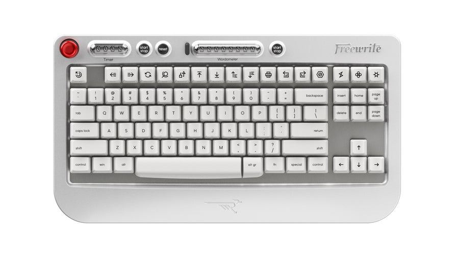 Wordrunner keyboard in silver aluminium, with a red button, a mechanical timer counter and an 8-digit electromechanical word counter above the key rows