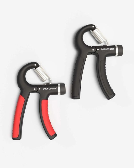 Gods of Grip adjustable gripper with black padded handles and a red accent, beside its box