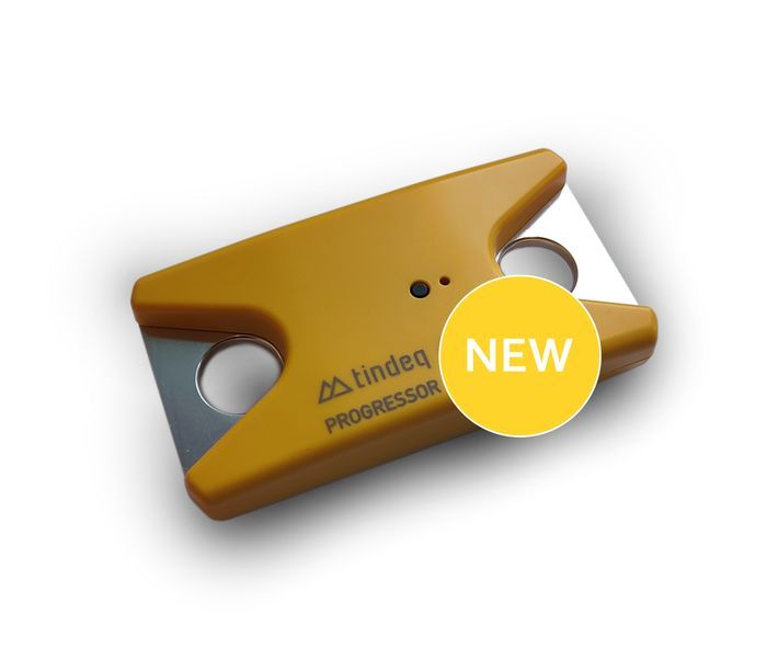 Tindeq Progressor force gauge, a compact gold anodised block with a top attachment point