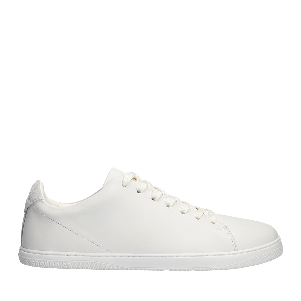 Groundies Zero in White, side profile, showing the flat sole and low leather upper