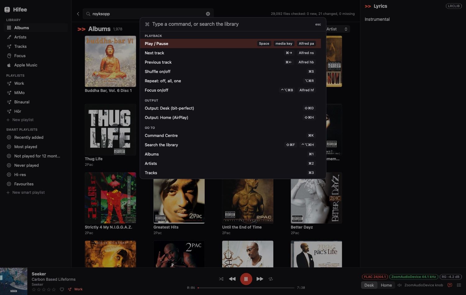 The Hifee Command Centre over the album grid: a search field, then commands grouped under Playback, Output and Go to, each with its keyboard shortcut and Alfred keyword on the right