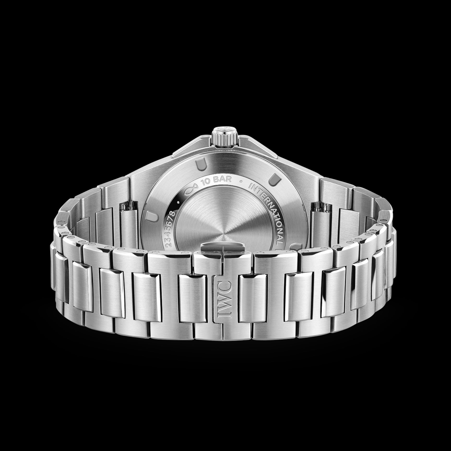 Rear three-quarter view showing the H-link bracelet curving away from the case and the concealed folding clasp stamped IWC