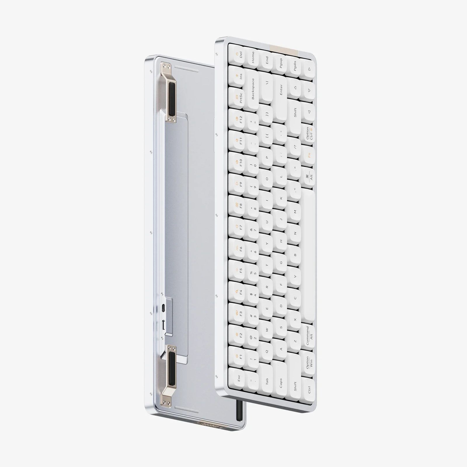 Exploded view of the Flow84 showing the keyboard assembly lifted away from the aluminium bottom case, revealing the internal plate and USB-C port