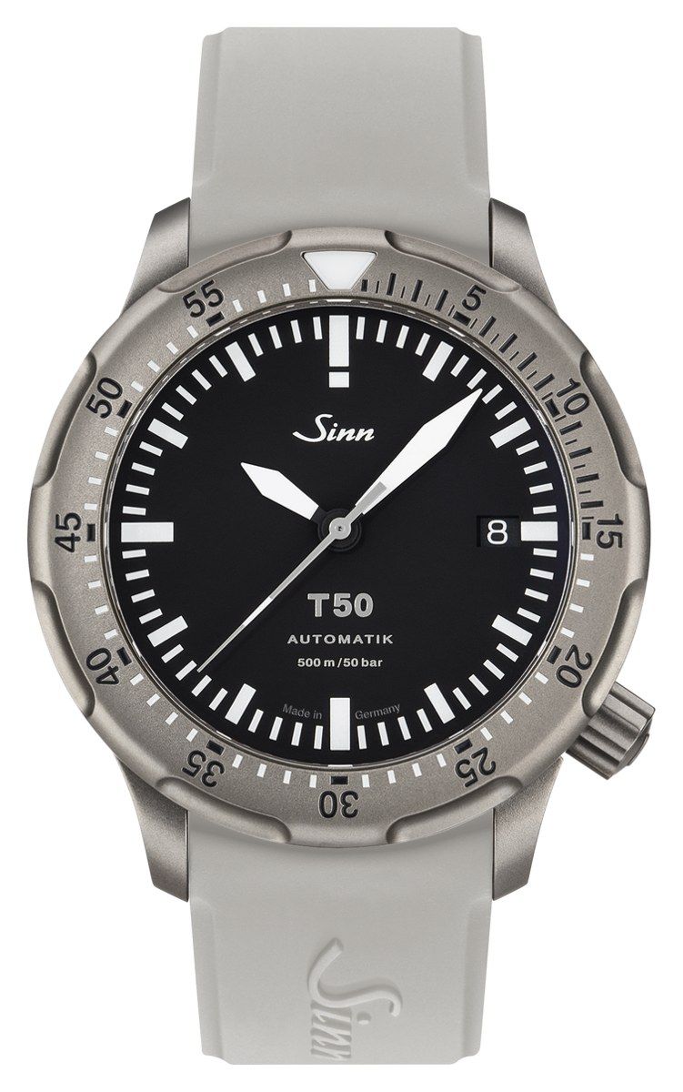 Sinn T50 in bead-blasted titanium on a grey silicone strap: matte black dial with large white sword hands, a date window at 4 o'clock and a scalloped titanium dive bezel