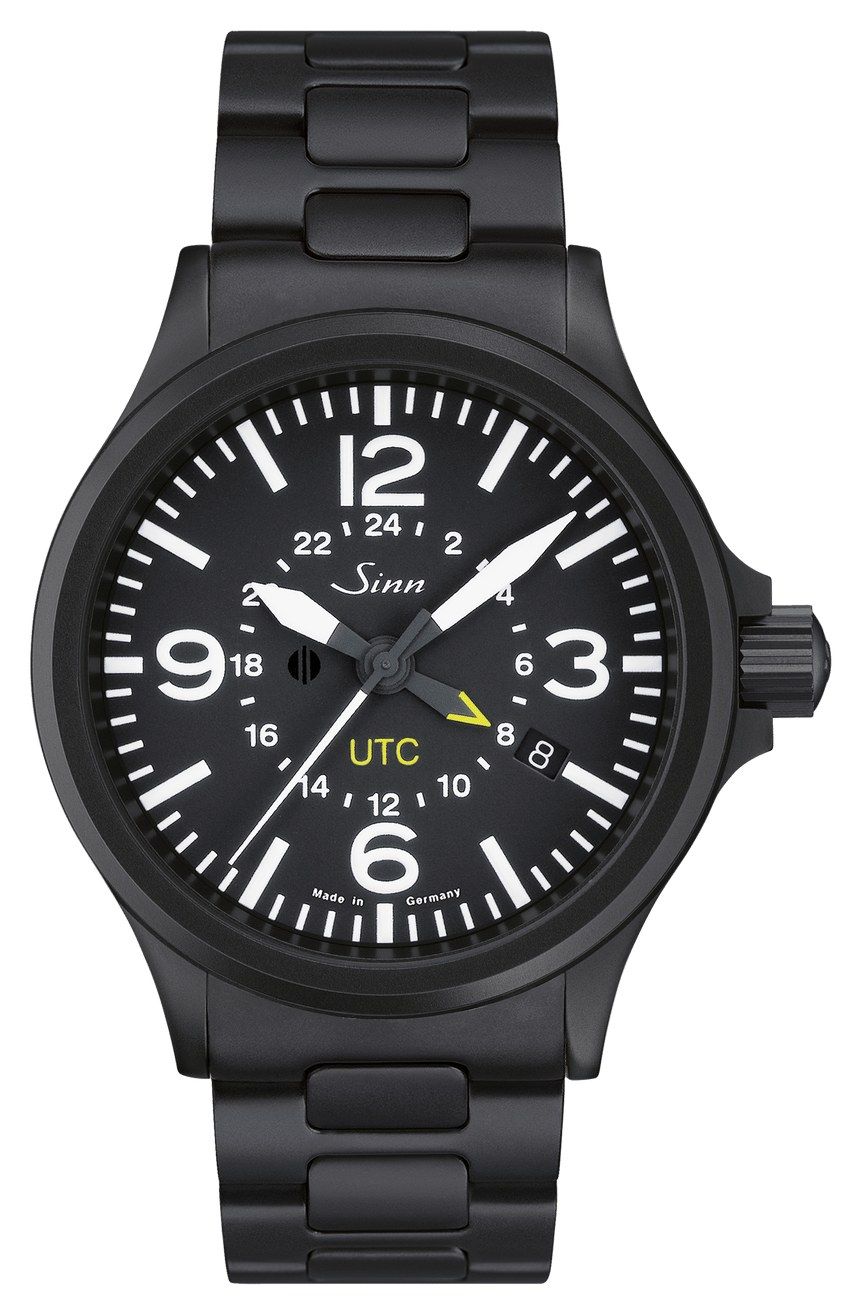 Sinn 856 S UTC in black-coated steel on a black bracelet: black pilot dial with large white numerals, a 24-hour scale and a yellow-tipped UTC hand, my daily watch since 2009