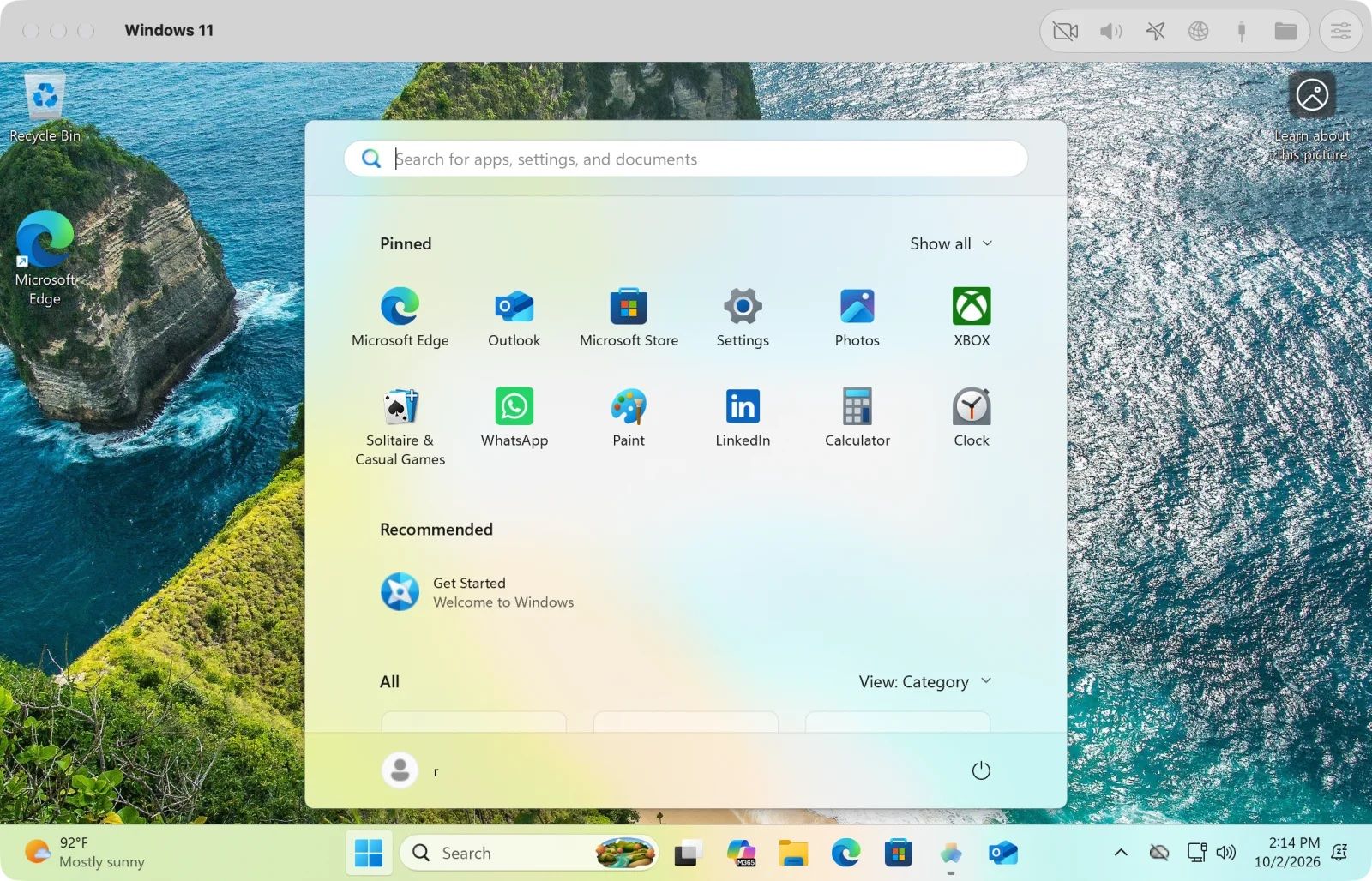 Windows 11 running in a VMPal window on a Mac, with the Start menu open over a coastal cliff wallpaper and the VMPal toolbar at the top