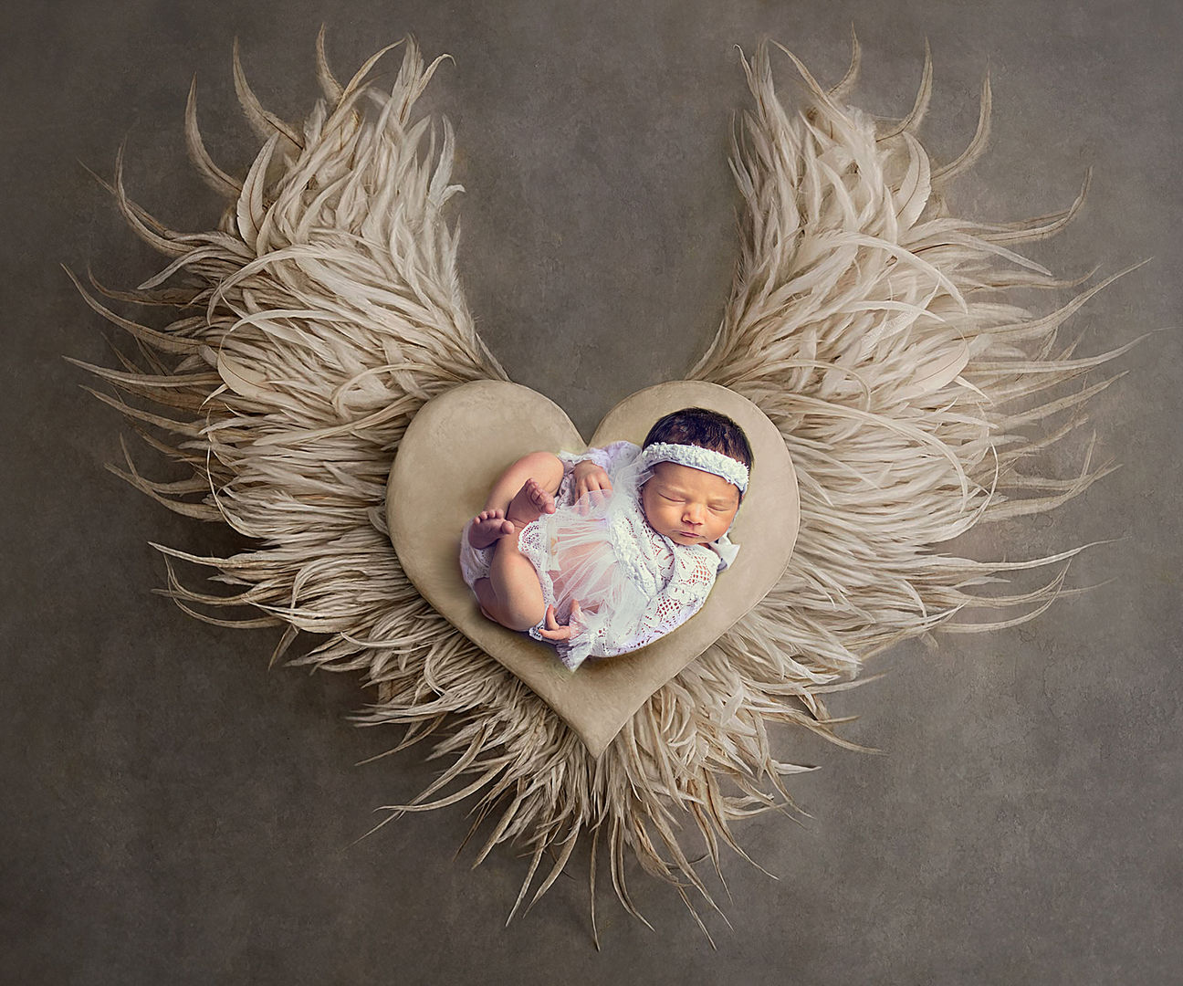 Newborn baby in posed composition - fine art baby photography