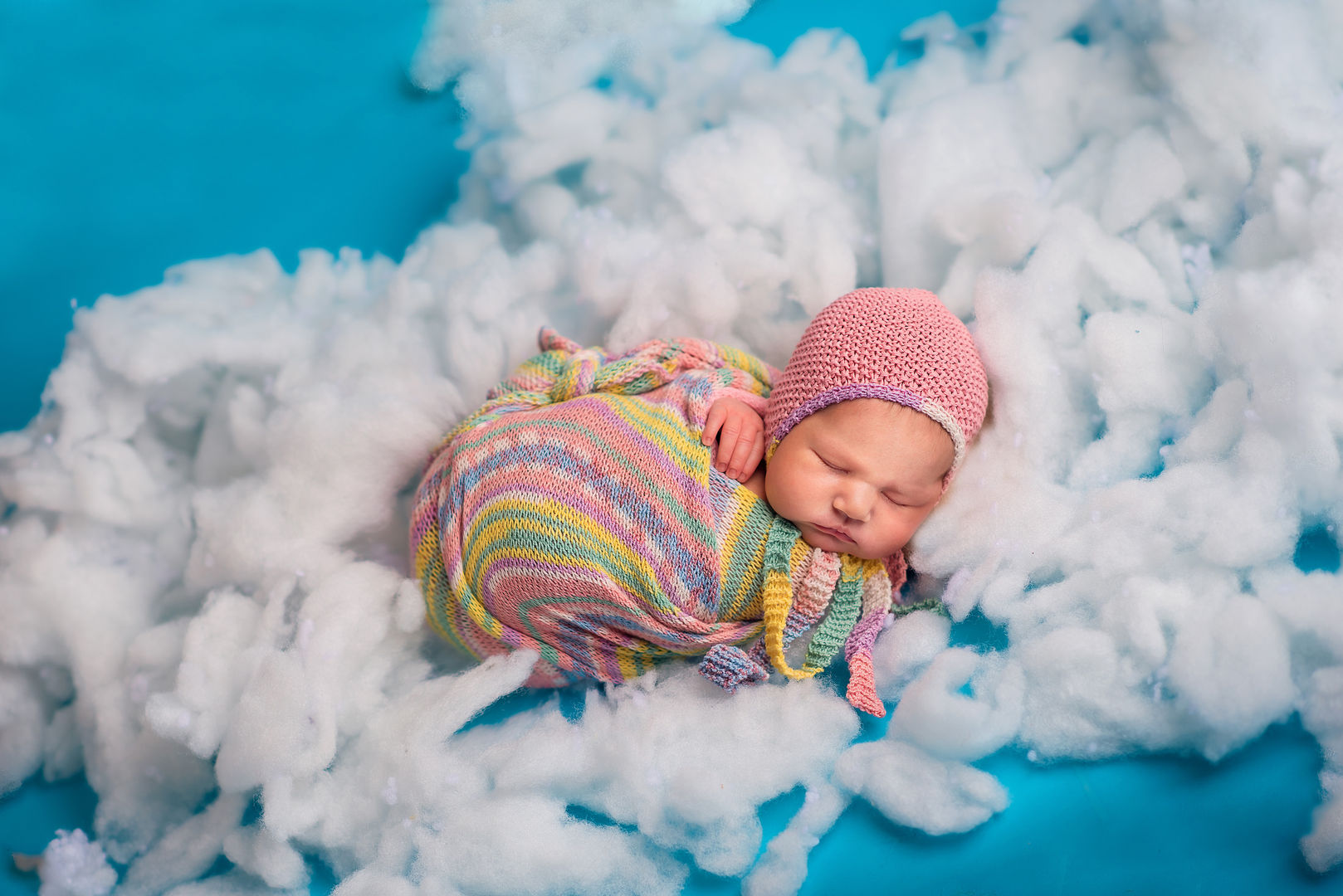 Styled newborn portrait with soft colors - artistic baby photography