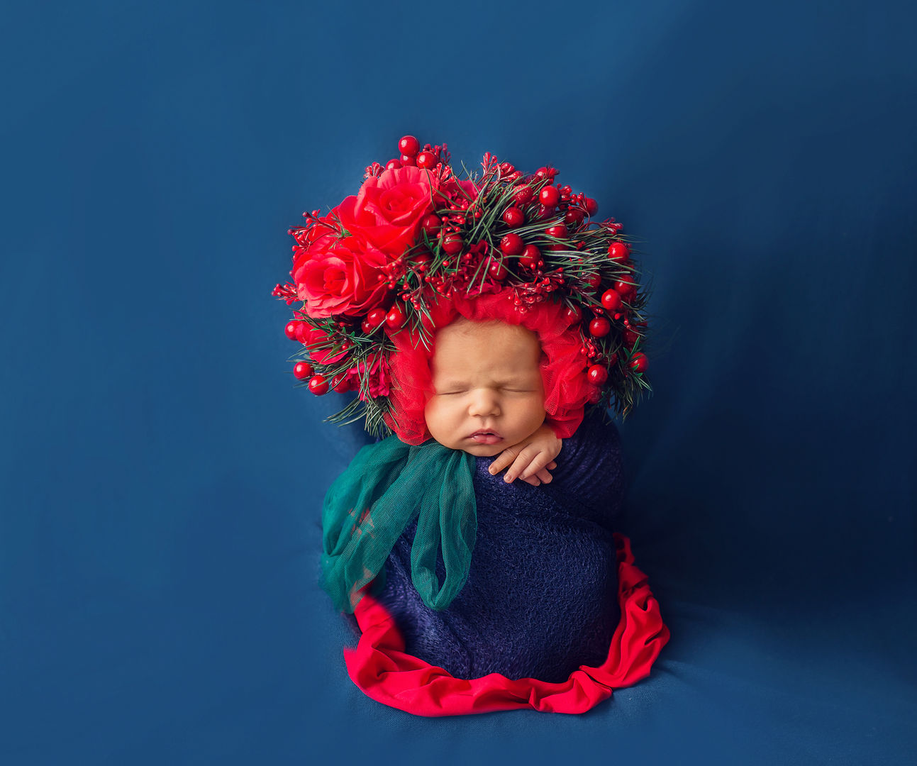 Newborn with dramatic red floral crown - artistic baby photography Los Angeles