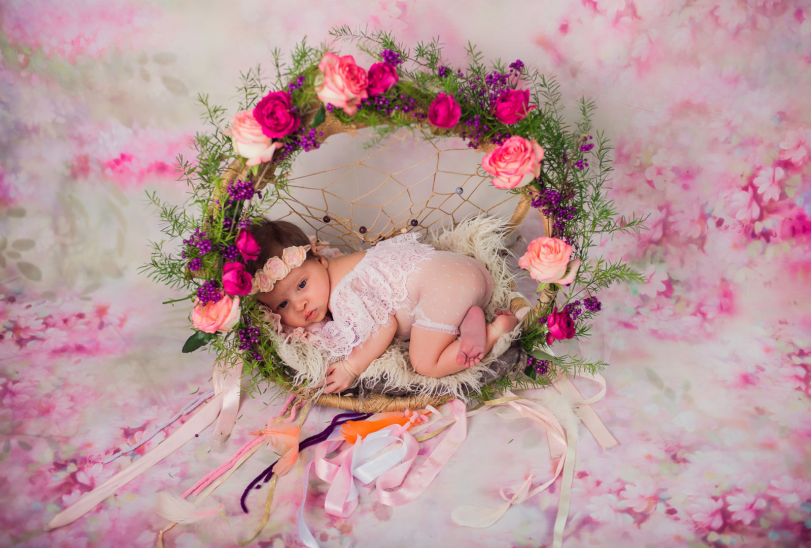 Newborn baby with floral accents - styled baby portrait