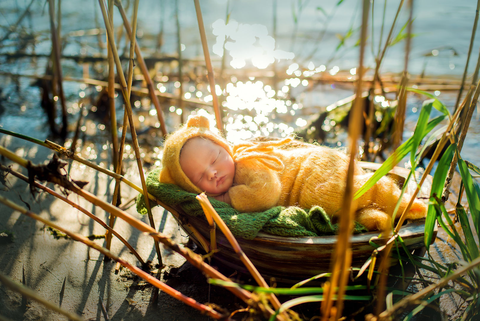 Newborn baby in yellow outfit - dreamy baby photography