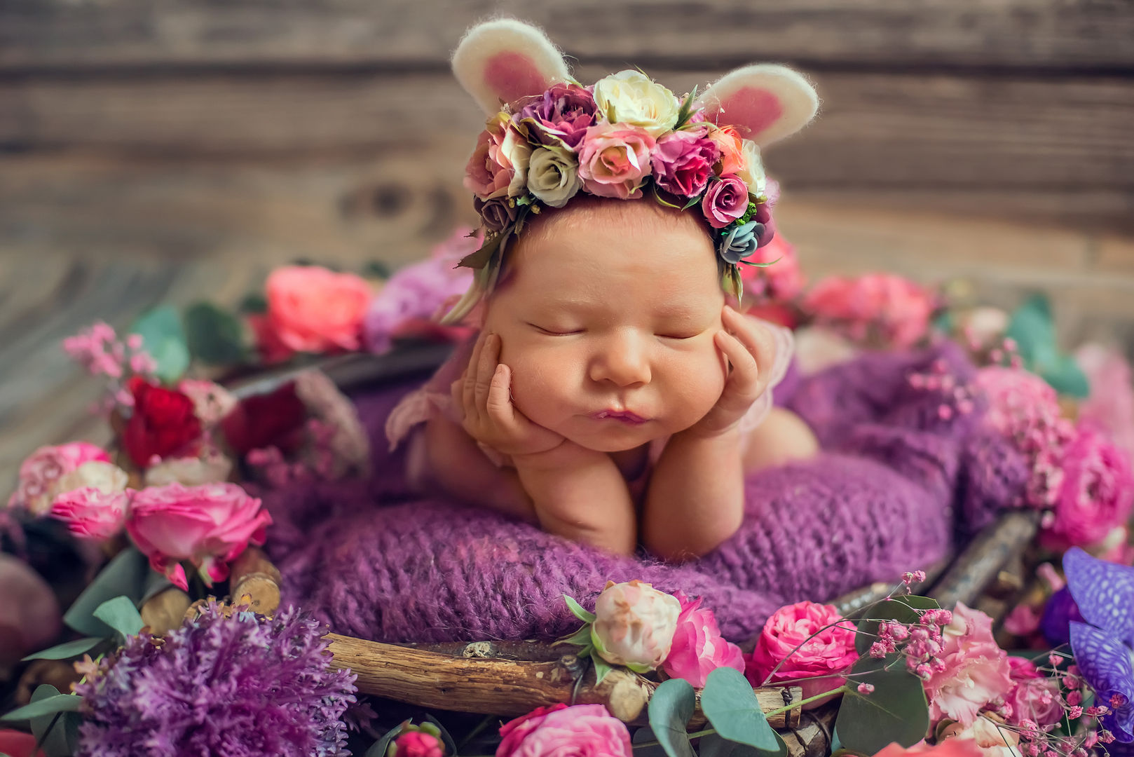 Newborn baby with flower crown - artistic baby portrait