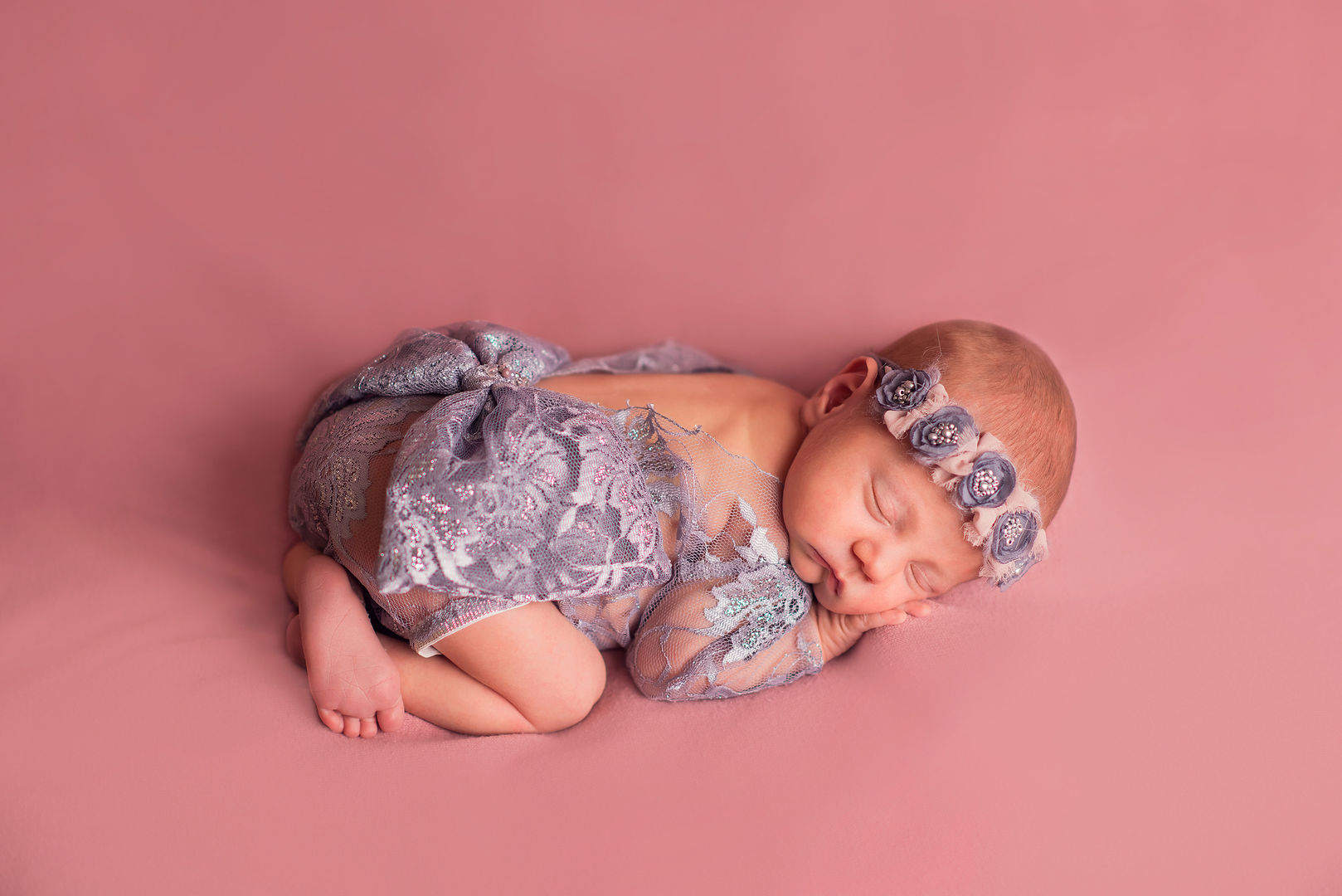 Newborn with floral crown - artistic baby portrait