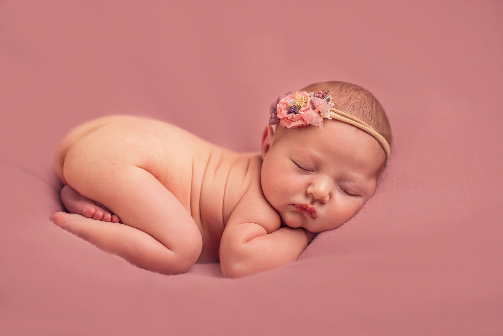 Peaceful sleeping newborn - styled baby photography