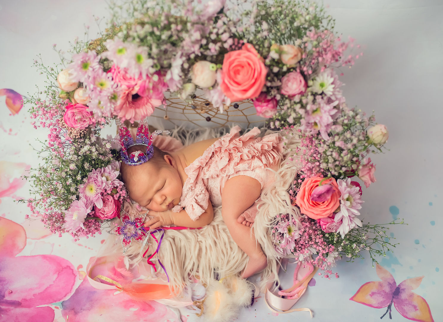 Newborn baby in floral arrangement - artistic baby photography