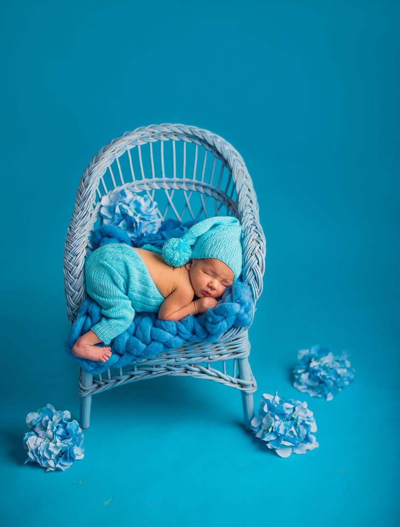 Newborn with props and floral accents - artistic baby photography