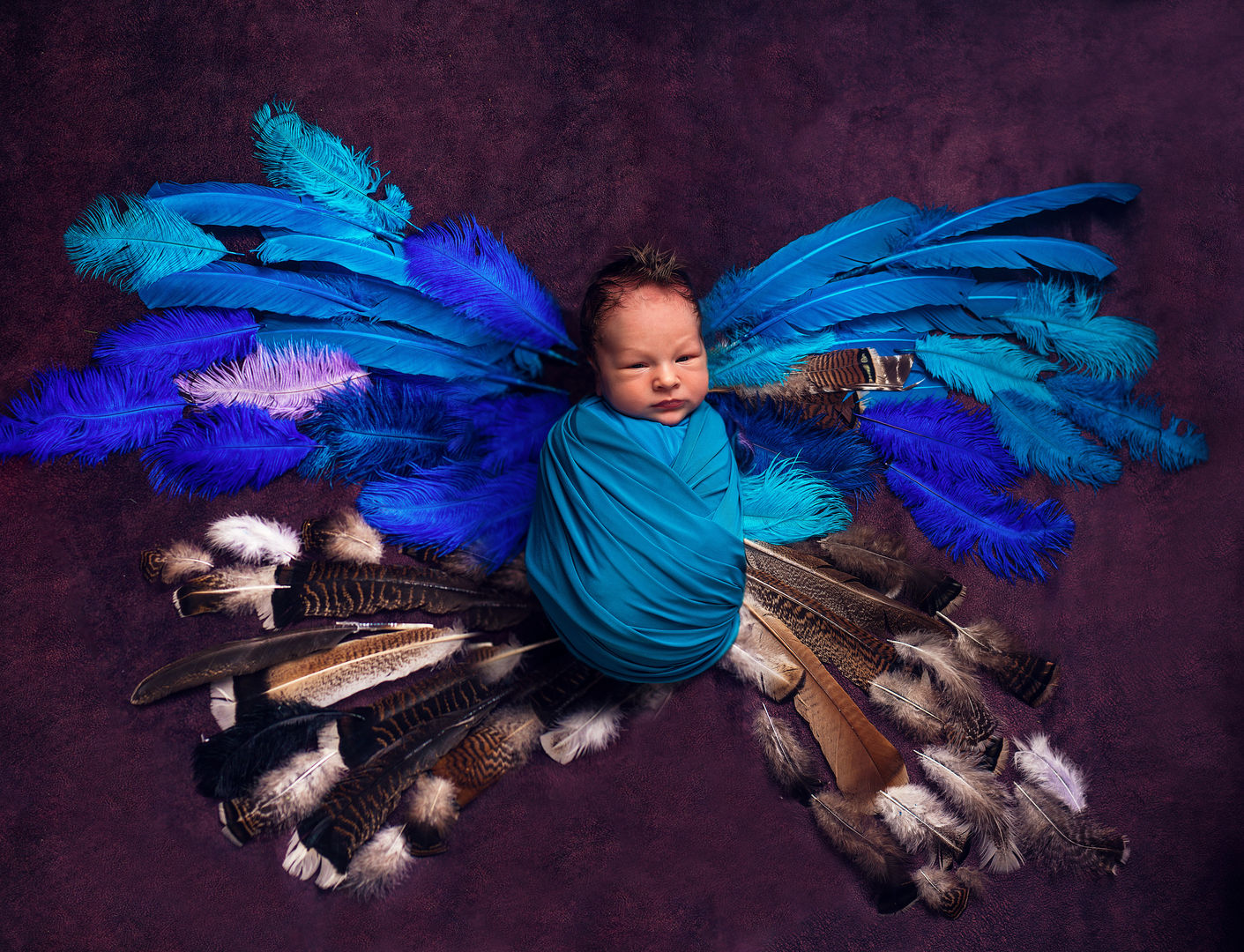 Newborn baby in basket with flowers - artistic newborn photography Los Angeles