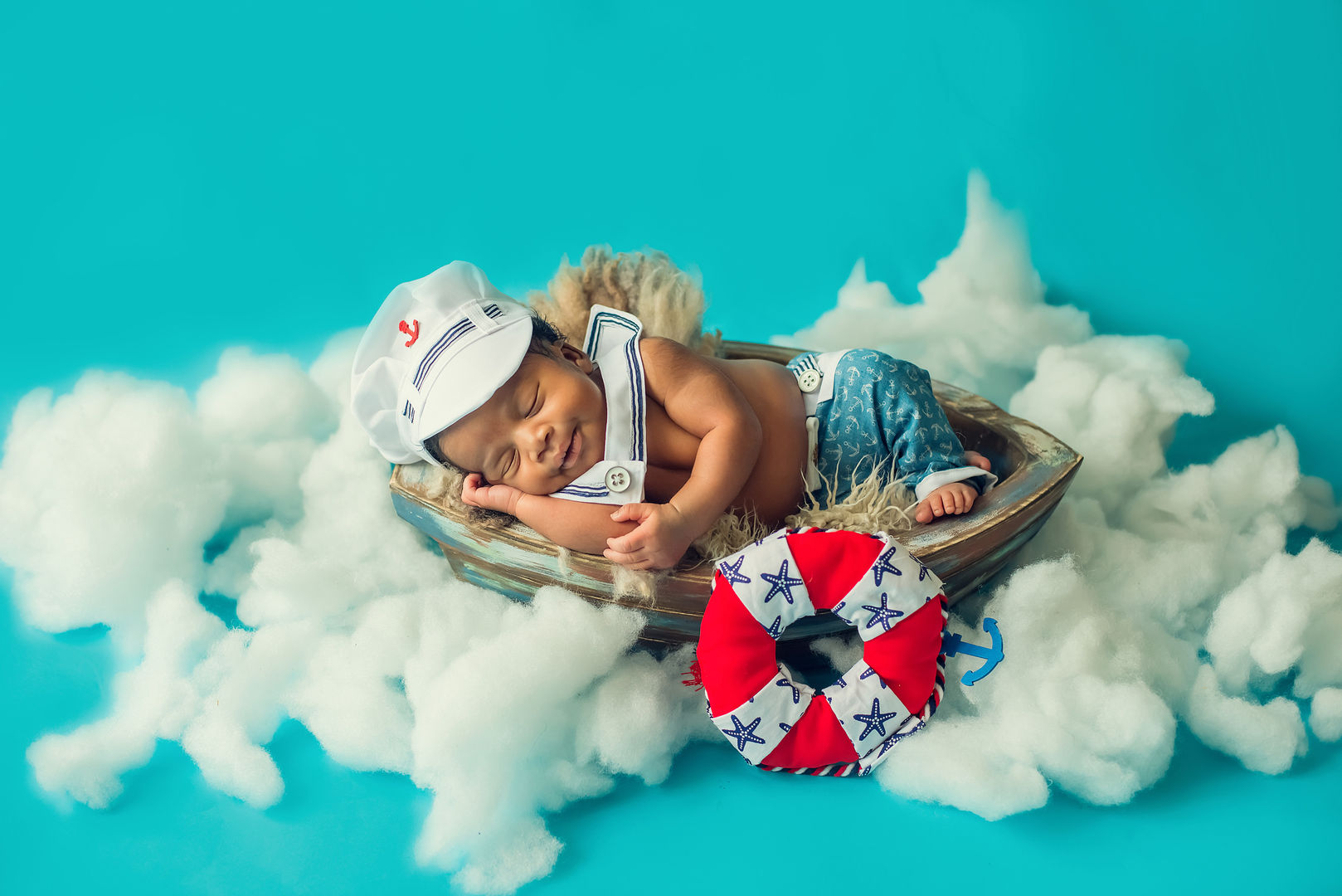 Newborn baby in basket - styled baby photography Los Angeles