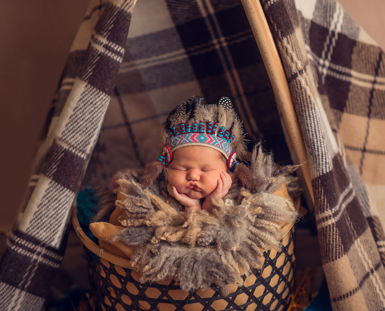 Newborn baby in basket - artistic baby photography