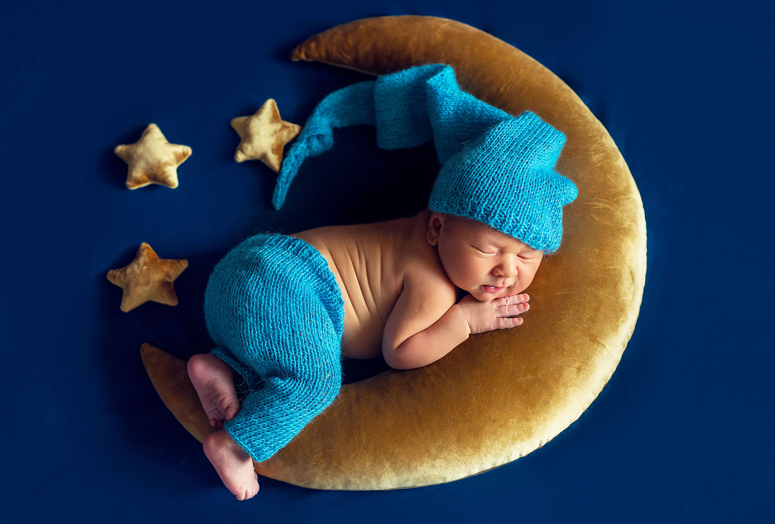 Sleeping newborn baby in basket - fine art newborn photography
