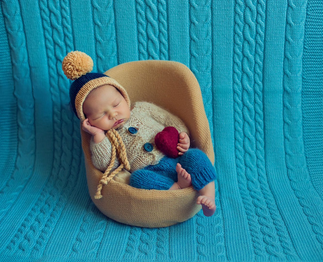 Newborn baby in basket with soft props - fine art baby photography