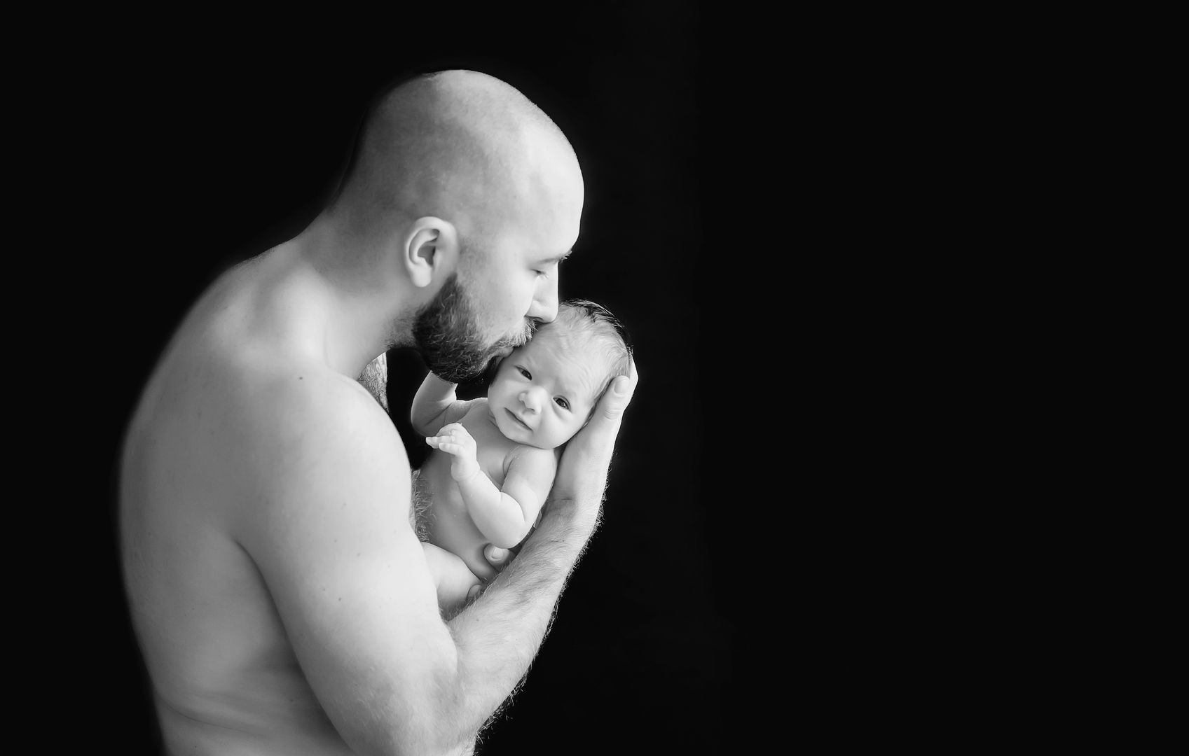 Intimate newborn lifestyle portrait in black and white